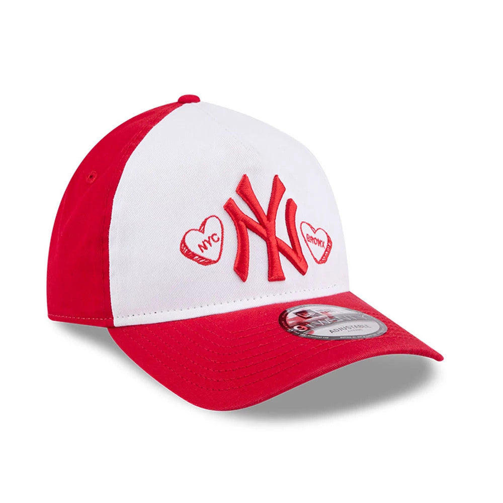 New York Yankees MLB Conversation Hearts Red New Era 9TWENTY A-Frame Adjustable Cap, front view showing the raised red Yankees logo flanked by embroidered hearts with NYC and Bronx lettering on the white crown.