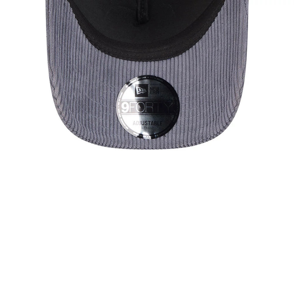 Pictured is this New Era Wide Cord 9FORTY A-Frame Trucker cap in dark blue. 7