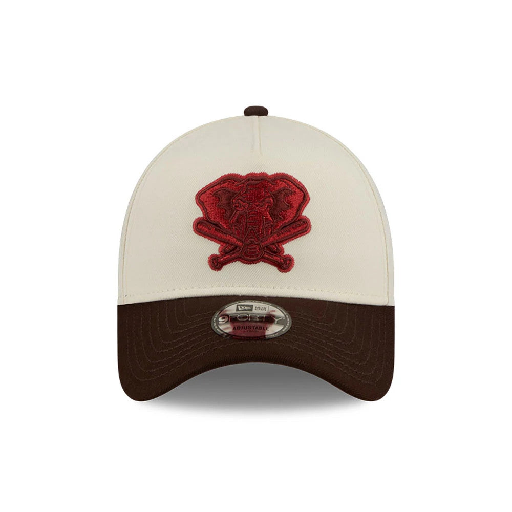 Athletics MLB City Script Cream New Era 9FORTY A-Frame Adjustable Cap, front view showing a raised red elephant and crossed bats logo embroidered on the cream front panel, with a brown curved visor and a 9FORTY size sticker on the visor.