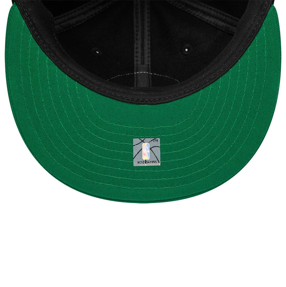Boston Celtics NBA Felt Logo Green Retro Crown New Era 59FIFTY Fitted Cap, inside view showing a green undervisor, black internal crown taping, and a size sticker placed centrally near the edge.