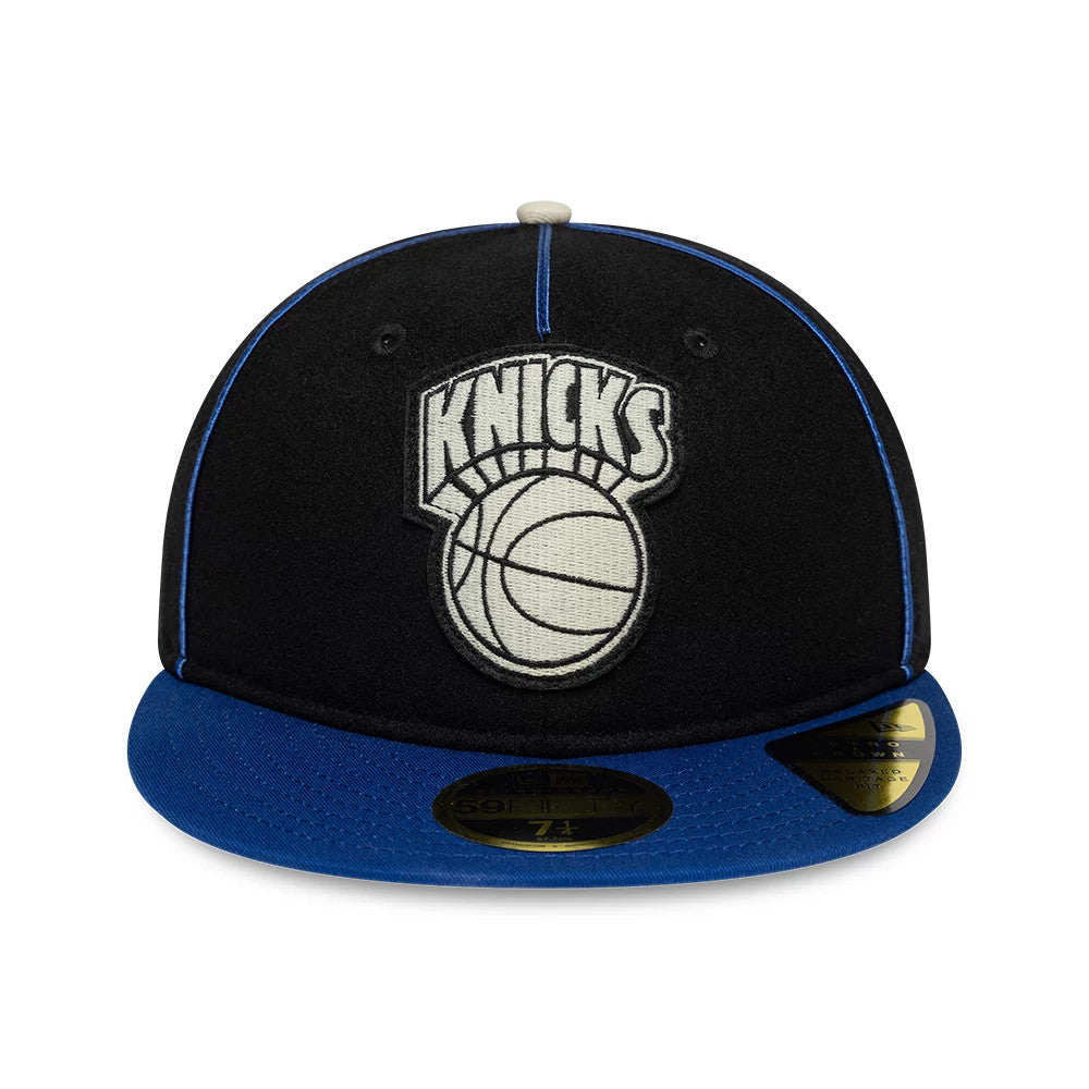 New York Knicks NBA Felt Logo Dark Blue Retro Crown New Era 59FIFTY Fitted Cap, front view showing the large felt Knicks logo embroidered on the black structured crown, with a bright blue visor and gold 59FIFTY size sticker.