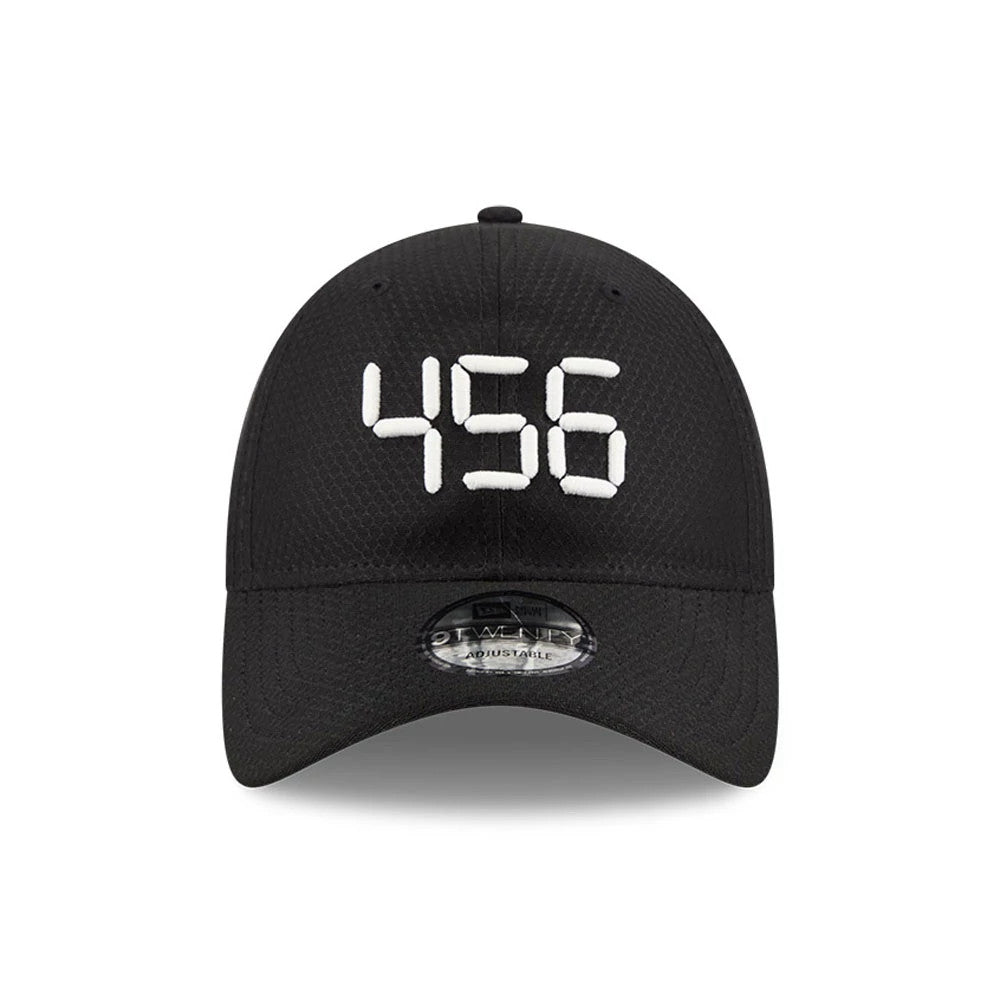 Netflix Squid Game 456 Black New Era 9TWENTY Adjustable Cap, front view showing white embroidered 456 centred on the black structured crown, with a pre-curved visor and a clear 9TWENTY size sticker on the centre.