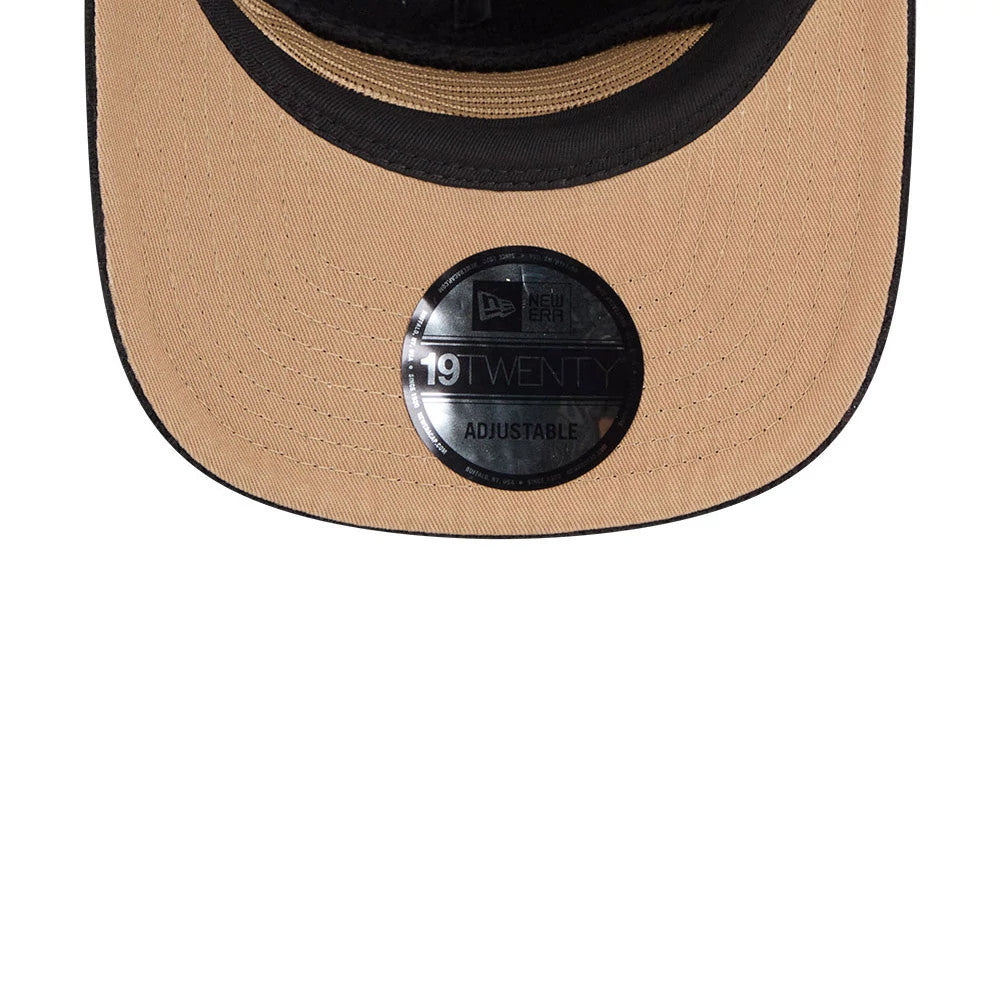 New Era Wide Cord Black 19TWENTY Adjustable Cap, close-up view showing a beige visor with a black border and the black 19TWENTY size sticker affixed to the centre, highlighting the textured fabric weave.