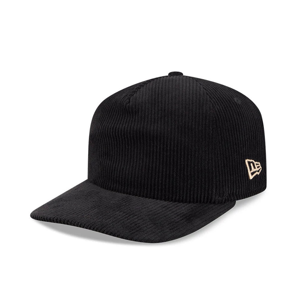 New Era Wide Cord Black 19TWENTY Adjustable Cap, three-quarter view showing the gold New Era flag logo on the left side, a wide corded black fabric covering the structured crown, and a matching black curved visor.