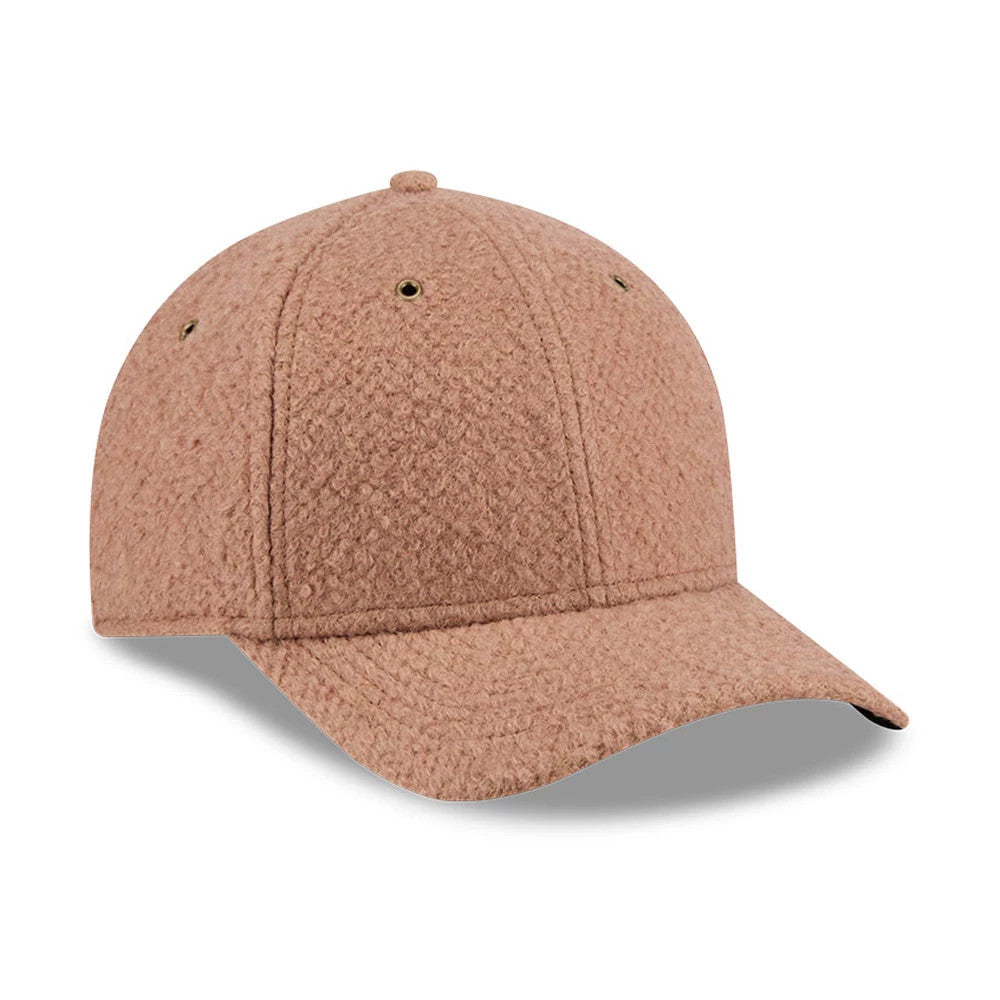 New Era Brushed Fleece Brown 9FORTY M-Crown Adjustable Cap, three-quarter view showing the textured brown fleece fabric on the structured crown, matching curved visor and round top button, with small air vent eyelets on each panel.
