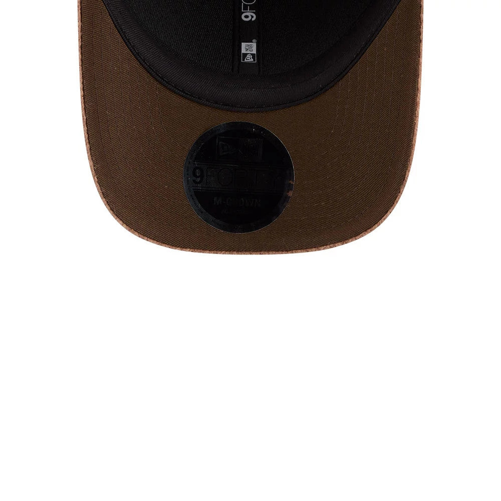 New Era Brushed Fleece Brown 9FORTY M-Crown Adjustable Cap, underside view showing the black sweatband with black New Era taping, brown undervisor, and the black 9FORTY size sticker near the edge of the curved visor.