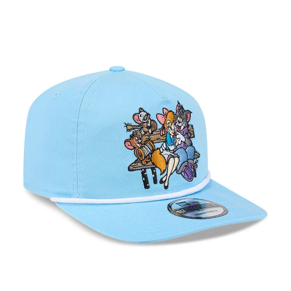 Tom & Jerry Serenade Pastel Blue New Era 19TWENTY Adjustable Cap, front view showing colourful embroidered cartoon characters on the front panel, a white accent line above the flat visor, and a 19TWENTY size sticker on the visor.