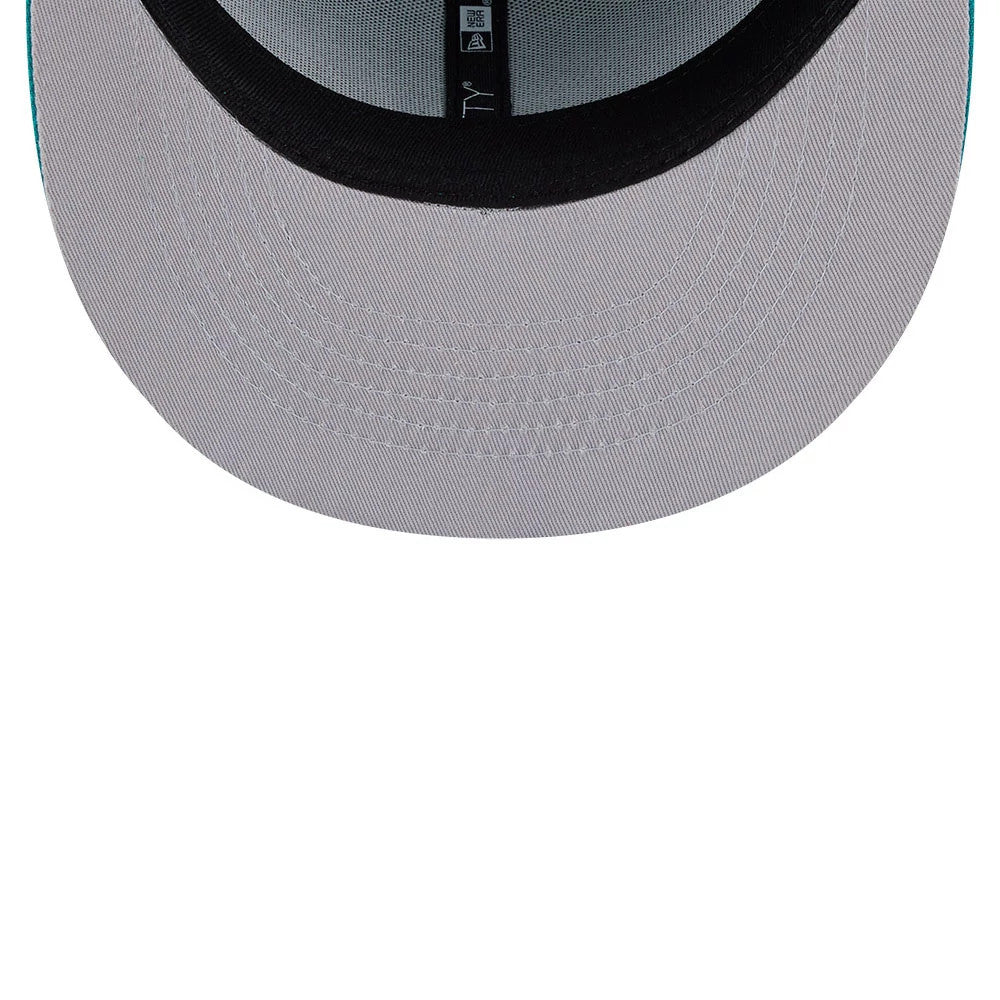 Netflix Squid Game 456 Patch Green New Era 59FIFTY Fitted Cap, inside view showing a grey undervisor, a black sweatband, and black New Era branded taping along the seams, providing a detailed look at the interior construction.