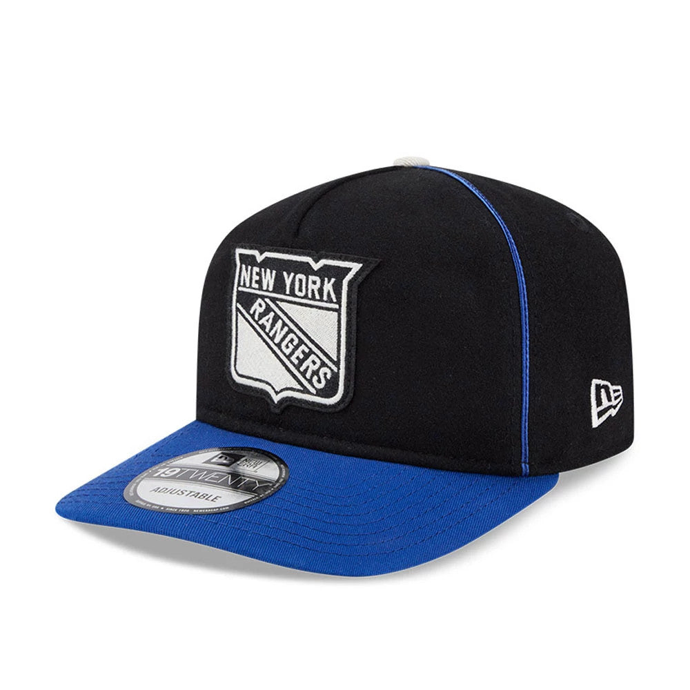 New York Rangers NHL Felt Logo Blue New Era 19TWENTY Adjustable Cap, three-quarter view showing the white felt Rangers logo on the front panel, a contrasting blue visor with the 19TWENTY size sticker, and the New Era flag logo on the left side.