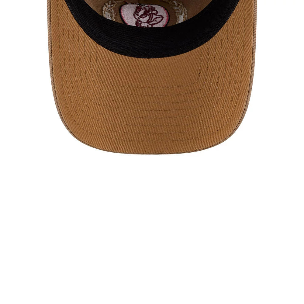 Tom & Jerry True Love Beige New Era 9TWENTY A-Frame Adjustable Cap, inside view showing the brown undervisor, black sweatband, and a pink embroidered Tom & Jerry motif on the inside panel.