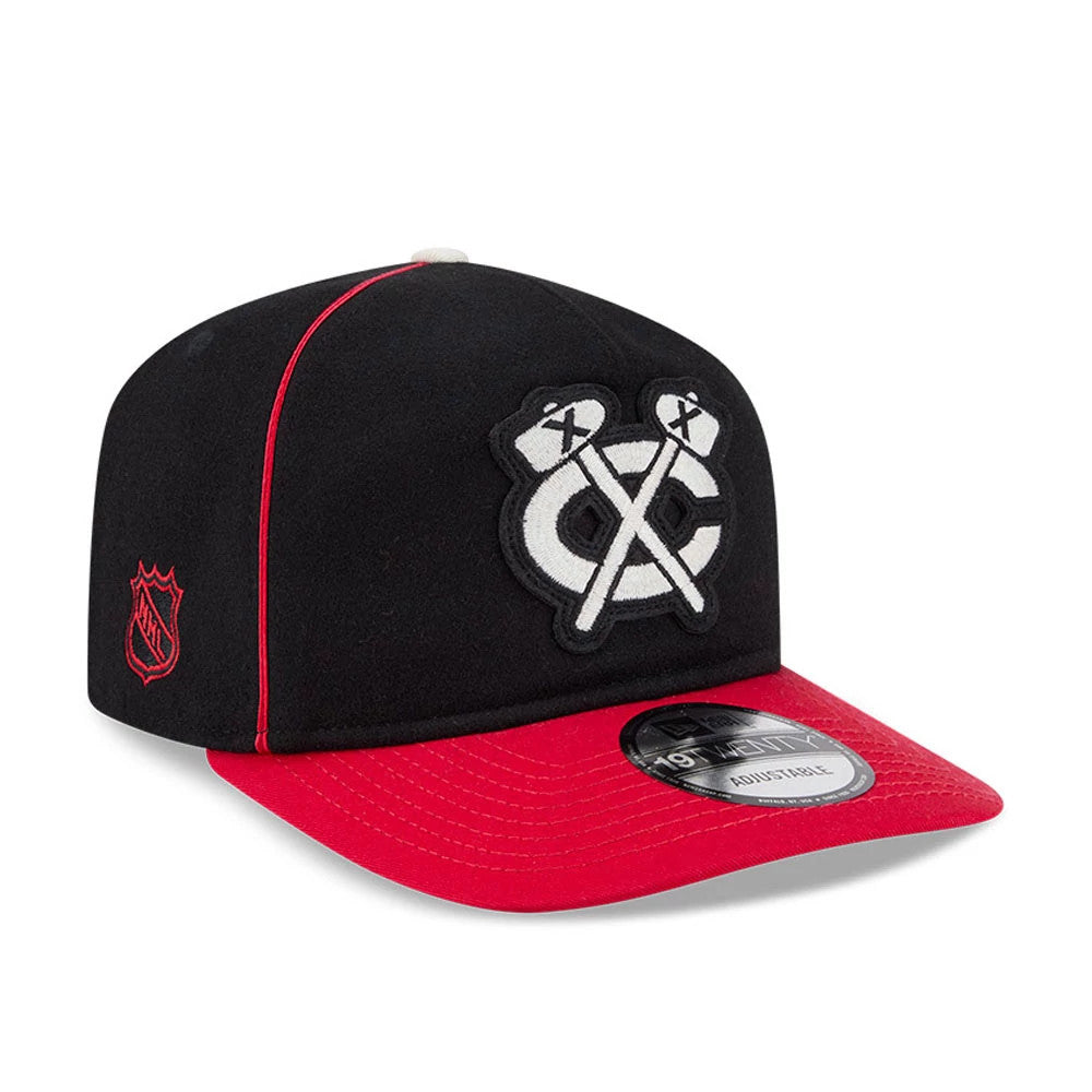 Chicago Blackhawks NHL Felt Logo Black New Era 19TWENTY Adjustable Cap, three-quarter view showing the raised white embroidered crossed hockey sticks logo on the front panel, a red NHL logo on the left side.