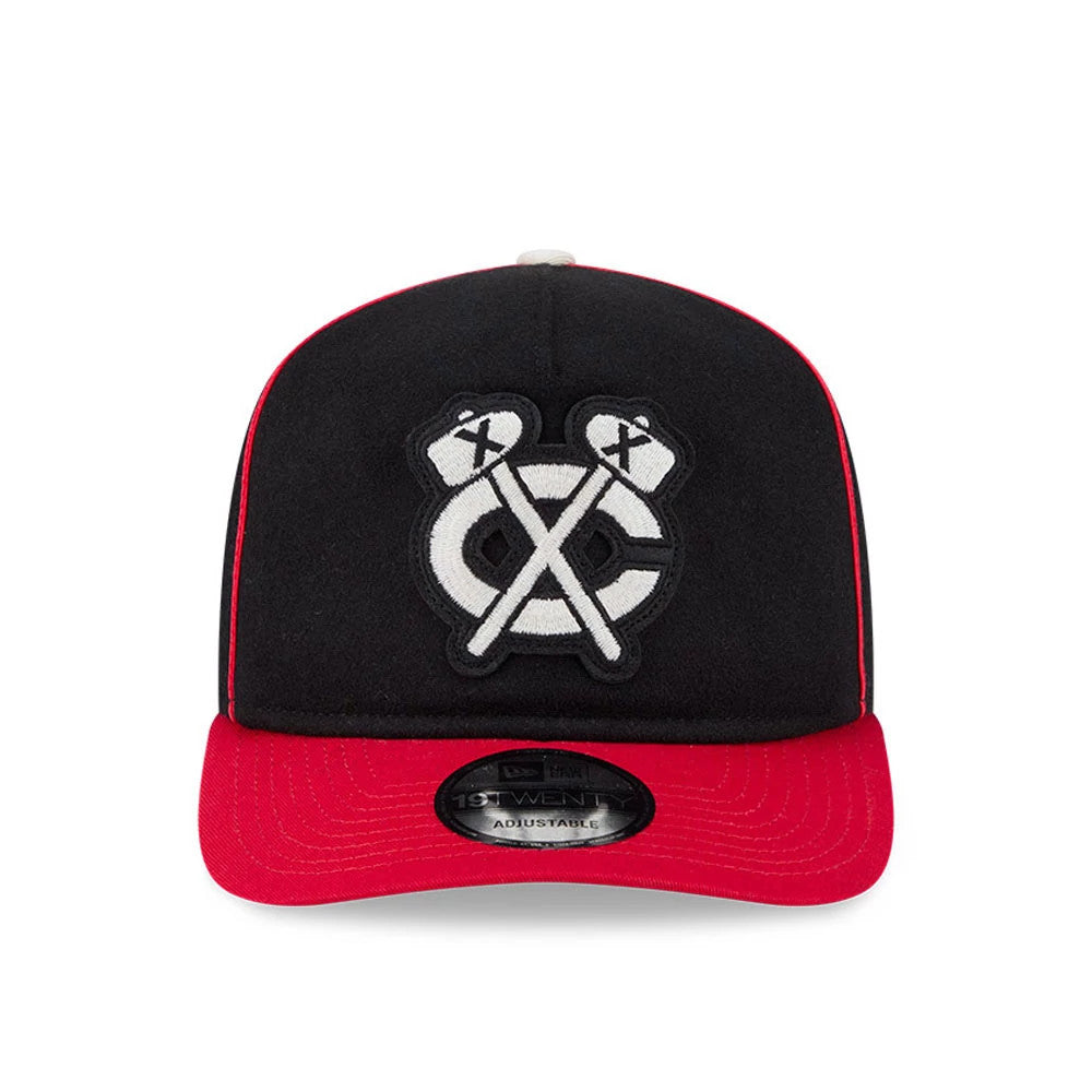 Chicago Blackhawks NHL Felt Logo Black New Era 19TWENTY Adjustable Cap, front view showing the black and white raised embroidered team logo on the front panel, with a bright red curved visor and a 19TWENTY size sticker on the centre.