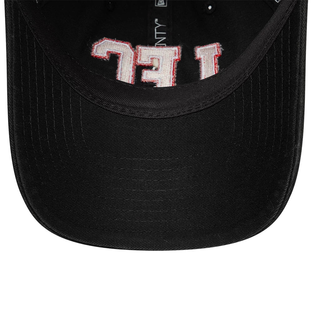 Liverpool FC Wordmark Black New Era 9TWENTY Adjustable Cap, inside view showing the black sweatband, branded taping along the interior seams, and the underside of Liverpool FC embroidery in red and cream against the black fabric.