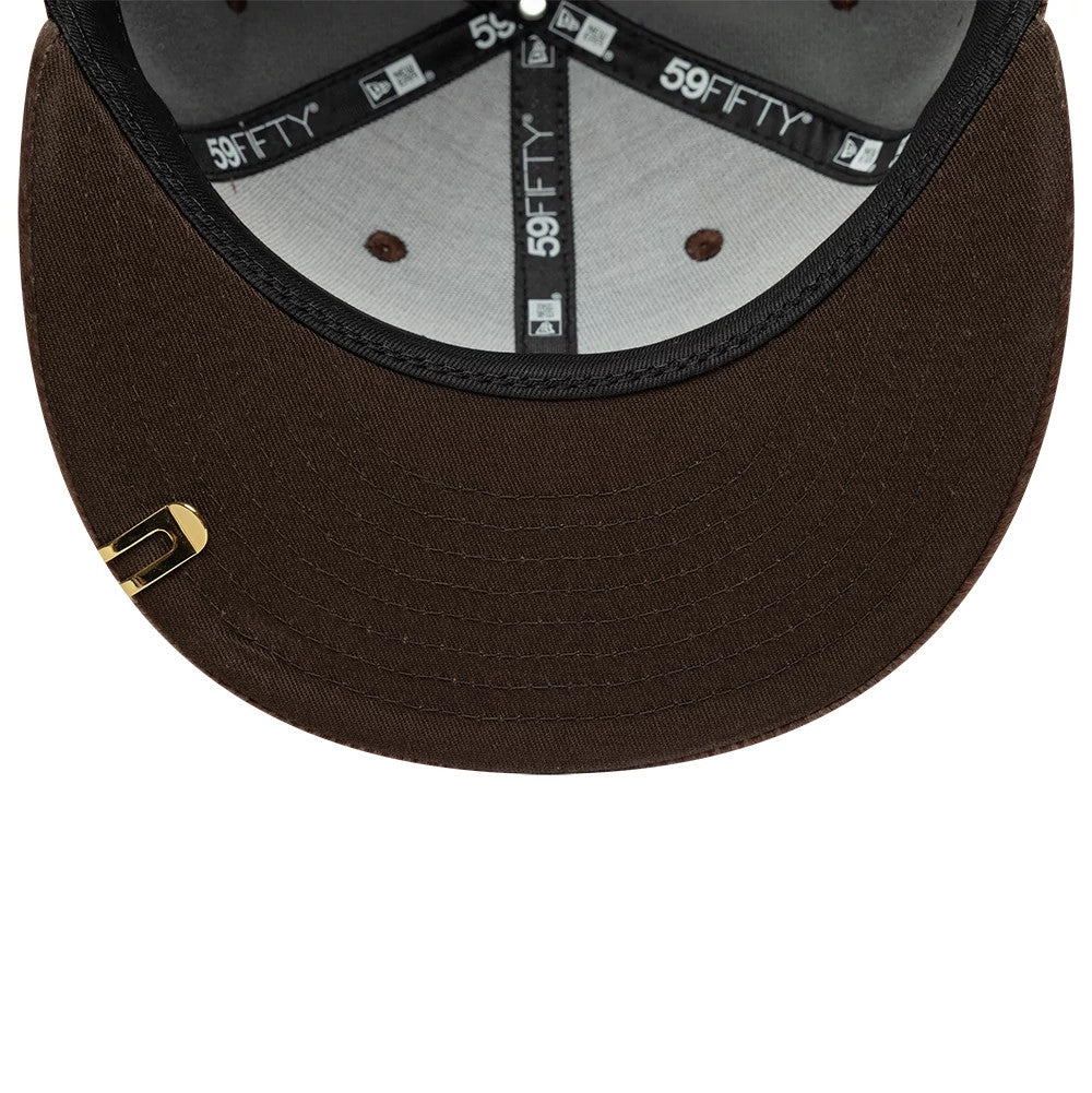 New Era Faux Pony Dark Brown 59FIFTY Fitted Cap, inside view showing black 59FIFTY taping across the grey panel interior, with brown embroidered eyelets and a gold pin on the dark brown undervisor.