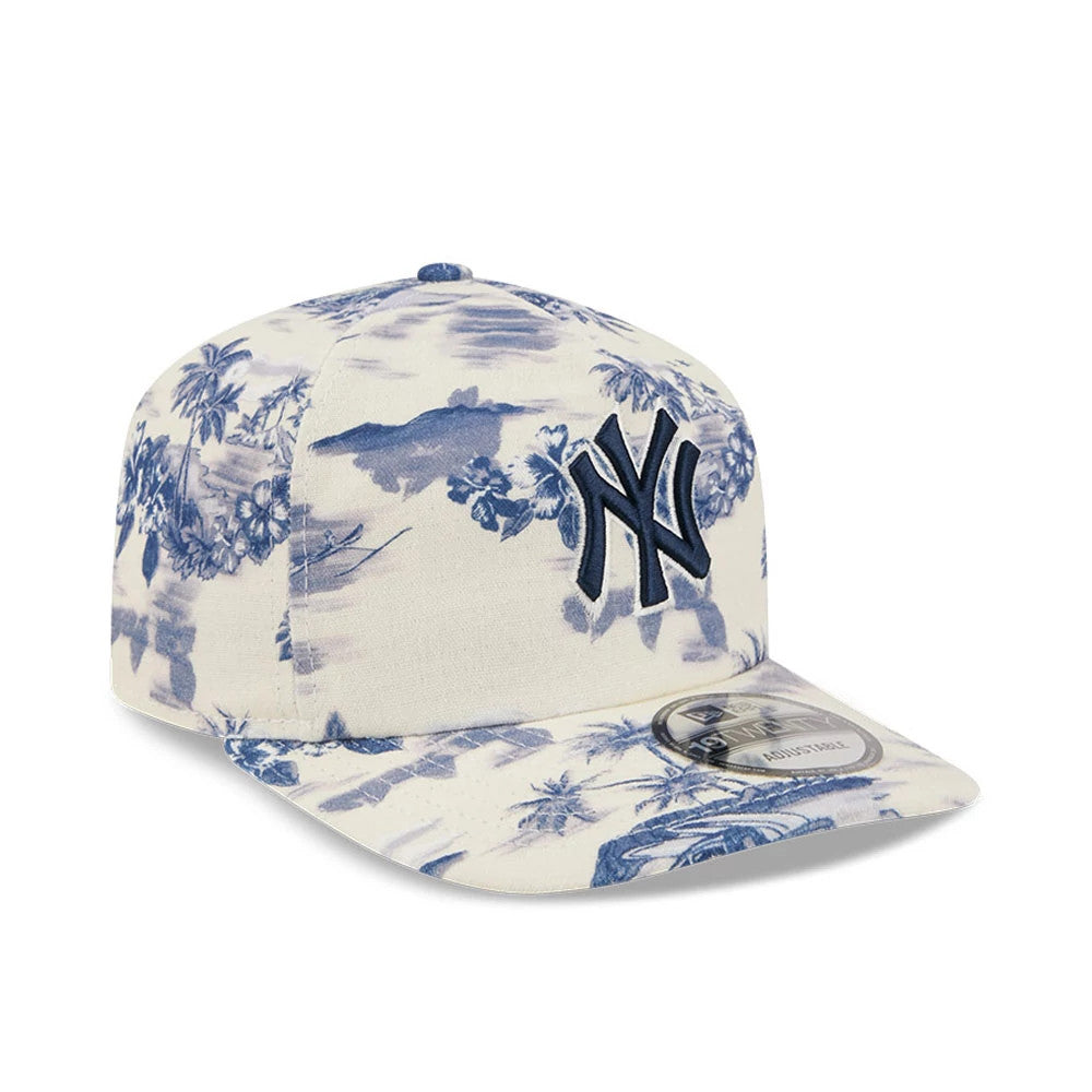 New York Yankees MLB Tropics Navy New Era 19TWENTY Adjustable Cap, three-quarter view showing the navy embroidered NY logo on a navy and cream tropical print crown, with a matching curved visor and 19TWENTY size sticker on the right side.