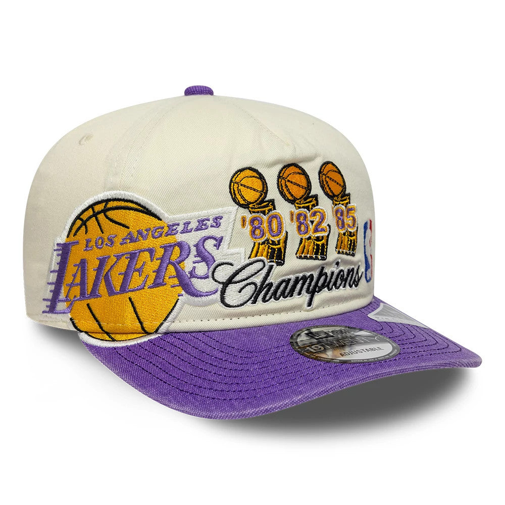 LA Lakers NBA Hardwood Classic Cream New Era 19TWENTY Adjustable Cap, three-quarter view showing the embroidered Lakers script with a basketball graphic on the front panel, three trophy graphics with years on the side.