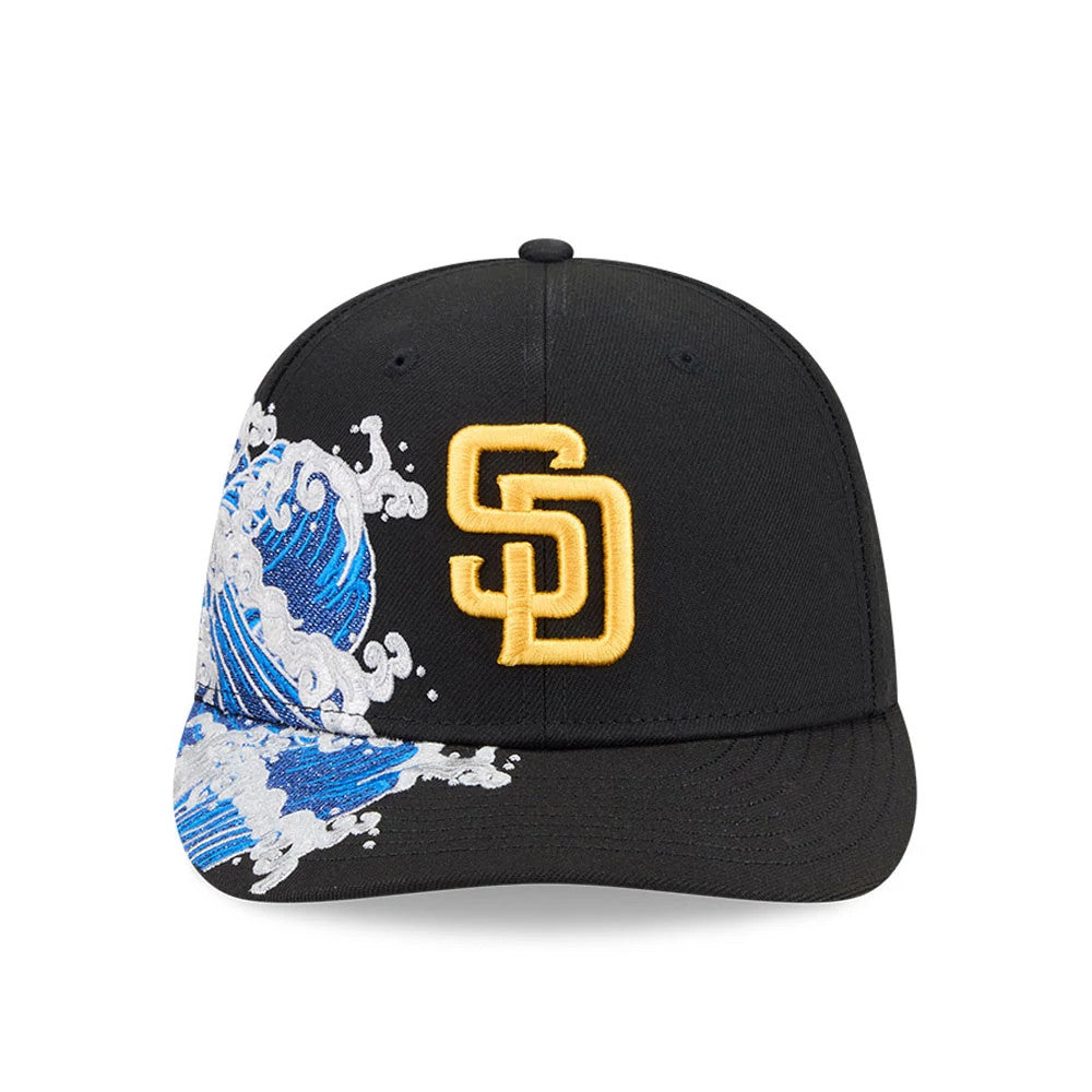 San Diego Padres MLB Vissurf Black New Era 9FIFTY Snapback Adjustable Cap, front view showing a yellow raised embroidered SD logo on the front panel with a dynamic blue and white wave design on the right side of the visor.