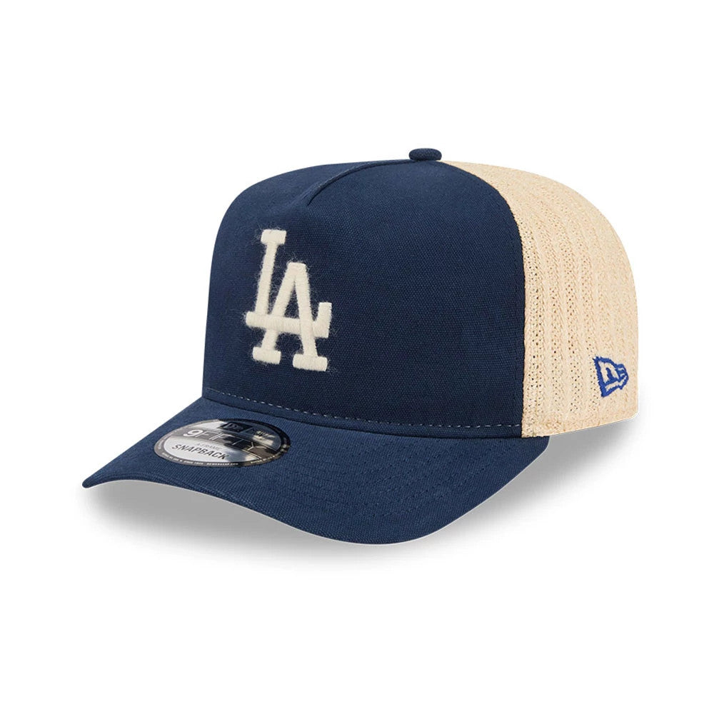 Pictured is this MLB Grained LA Dodgers 9FIFTY A-Frame Snapback cap in dark blue. 1