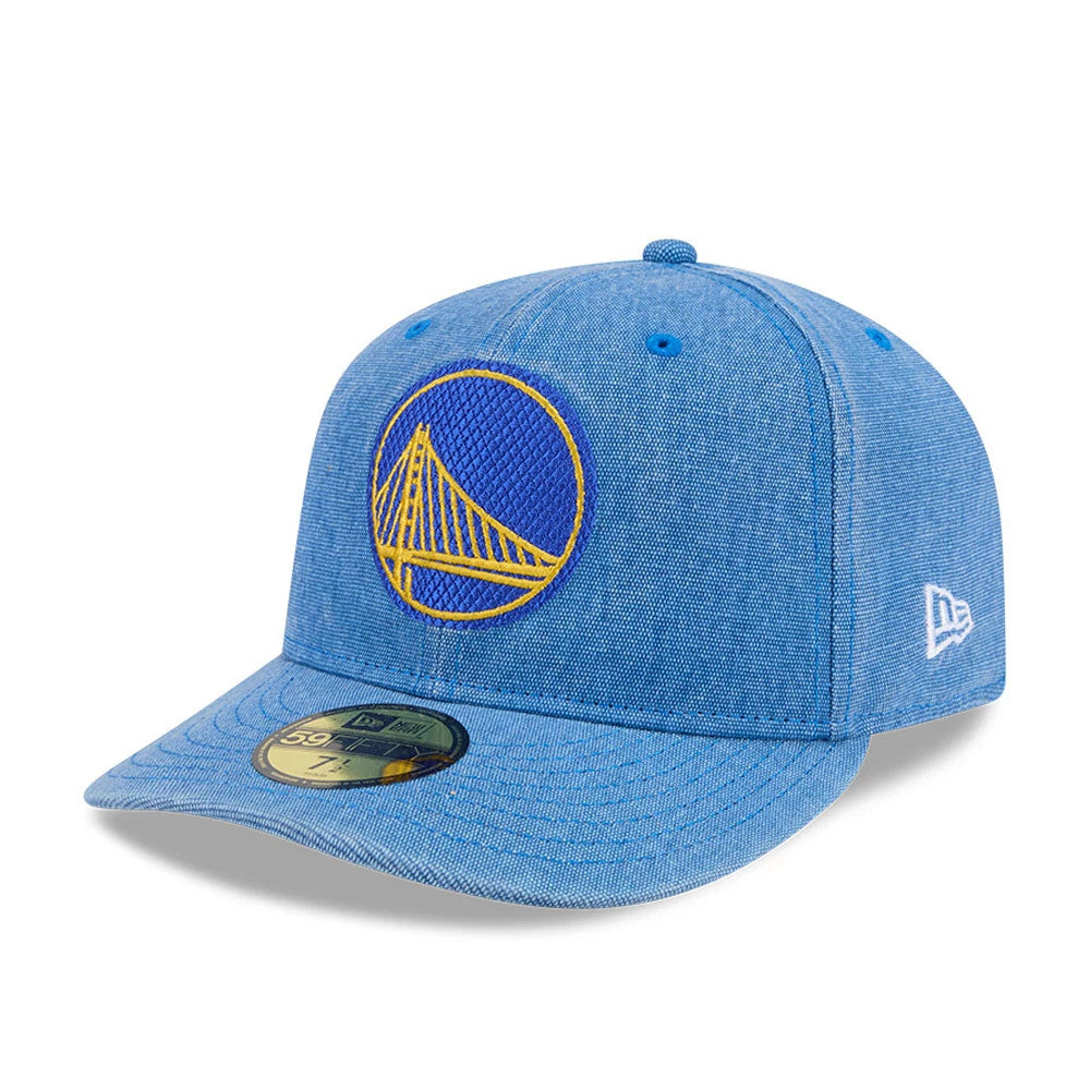 Warriors NBA Hardwood Classic Blue New Era 59FIFTY Fitted Cap, three-quarter view showing the raised yellow bridge logo on the front panel, gold 59FIFTY size sticker on the blue visor, and white embroidered New Era flag logo on the left side.