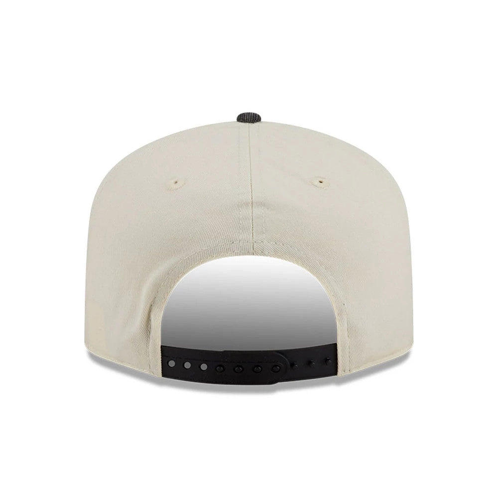 Chicago Bulls NBA Hardwood Classic Cream New Era 19TWENTY Adjustable Cap, rear view showing the absence of logos on the back panels, a black top button, and a black adjustable strap creating a contrast against the cream structured crown.