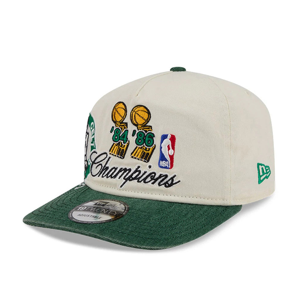 Boston Celtics NBA Hardwood Classic Green New Era 19TWENTY Adjustable Cap, front view showing embroidered Champions lettering and gold trophy graphics on the front panel, with a green flat visor and a 19TWENTY size sticker.