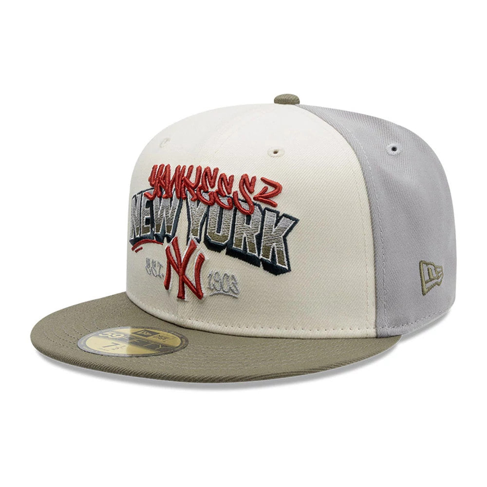 New York Yankees MLB Tagged Grey New Era 59FIFTY Fitted Cap, three-quarter view showing raised red and grey Yankees and New York lettering on the front panel, an olive flat visor with a gold 59FIFTY size sticker, and an olive New Era flag logo.