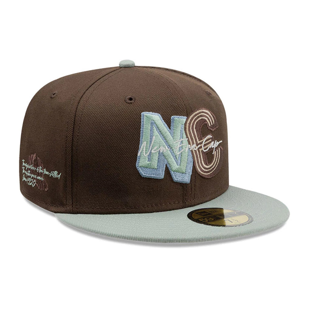New Era DIY Note Dark Brown 59FIFTY Fitted Cap, three-quarter view showing large NC letters in mint and tan raised embroidery on the front panel, a contrasting mint visor, brown crown, and a gold 59FIFTY size sticker on the visor.