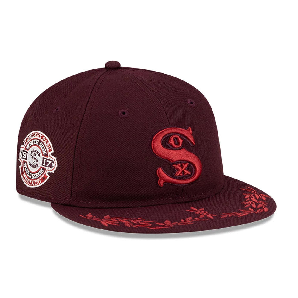 Chicago White Sox MLB Flourishes Purple Retro Crown New Era 9FIFTY Cap, front three-quarter view showing a raised red embroidered Sox logo on the front panel, red floral embroidery on the visor, and a decorative patch on the right side.
