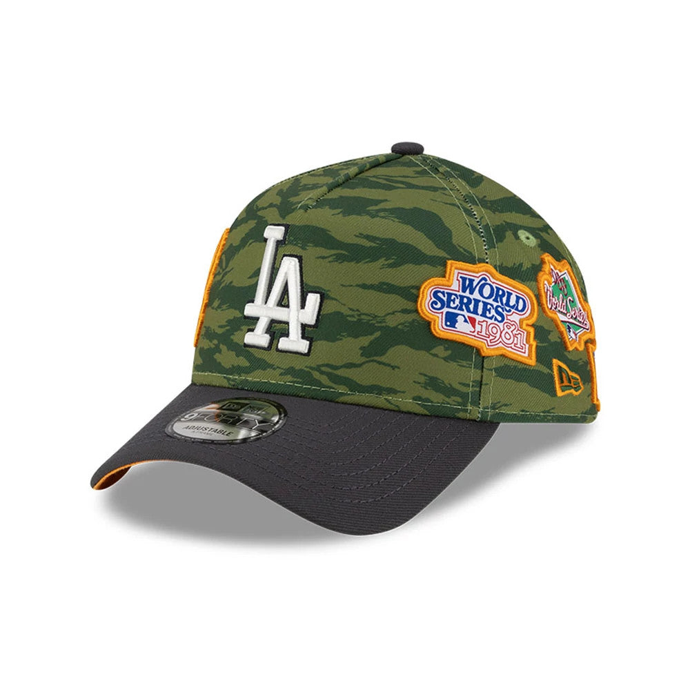 LA Dodgers MLB Tiger Camo Green New Era 9FORTY A-Frame Cap, three-quarter view showing the white embroidered LA logo on the front panel, a black curved visor with a 9FORTY size sticker, and colourful side patches.