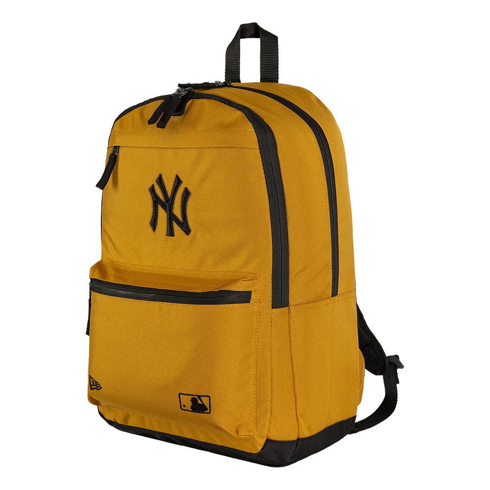 New Era New York Yankees MLB Yellow Delaware Backpack, three-quarter view showcasing the yellow backpack with a prominent black embroidered Yankees logo, a black zip running along the top front pocket.