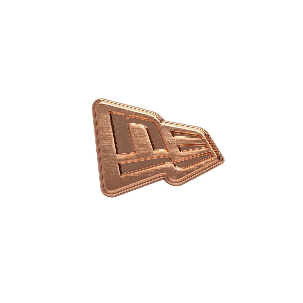 Pictured is this New Era Flag Rose Gold Pin Badge in rose gold. 1