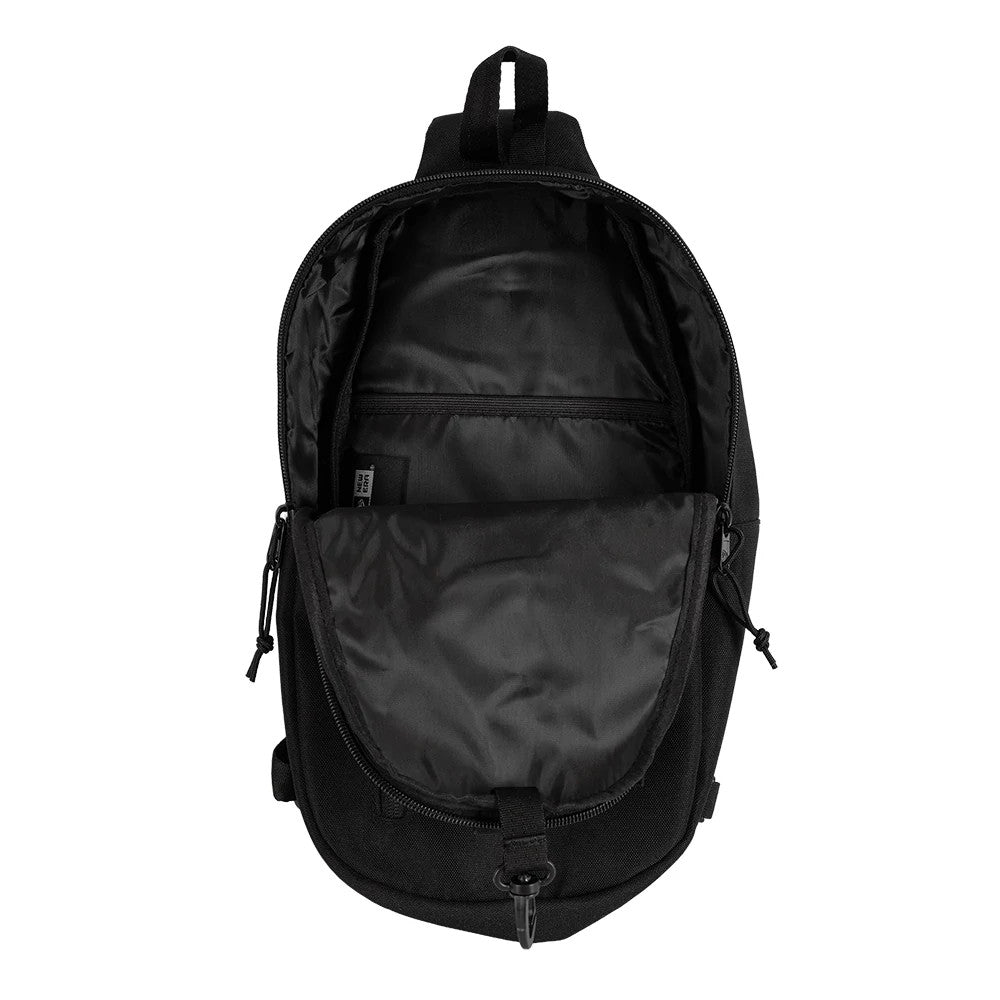 New Era Black Cross Body Sling Bag, open view showing the main compartment with a wide opening, inner zip pocket at the back, a zip closure with pulls on both sides, and a small hook at the bottom centre.