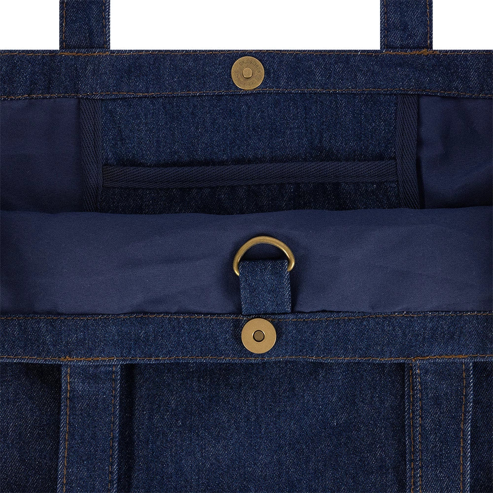 New Era New York Yankees MLB Suede Denim Navy Tote Bag, open view showing the interior lined in deep navy with a brass D-ring detail, central divider, magnetic snap closure at the top, and twin straps for carrying.