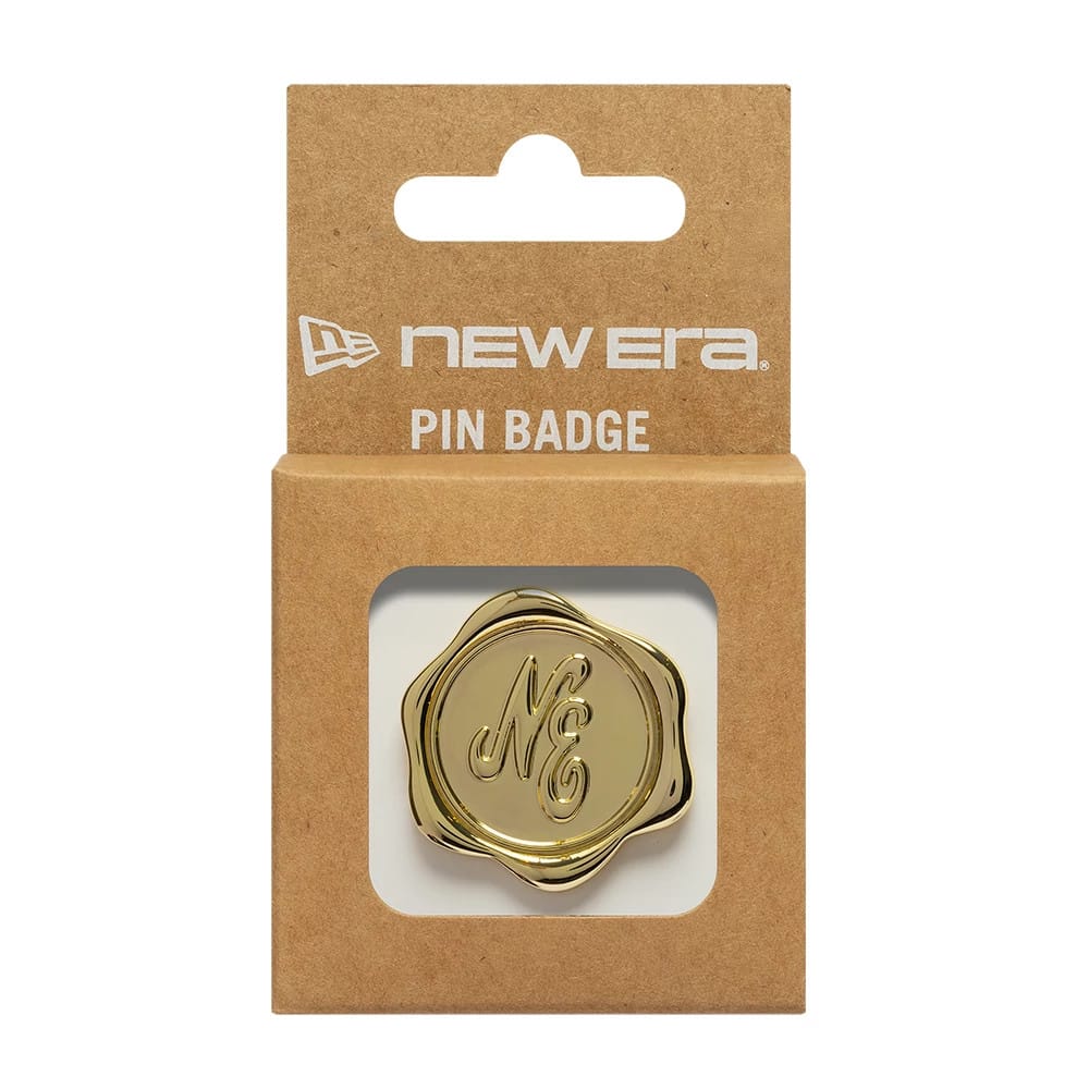 Pictured is this New Era Stamp Pin Badge in gold. 3
