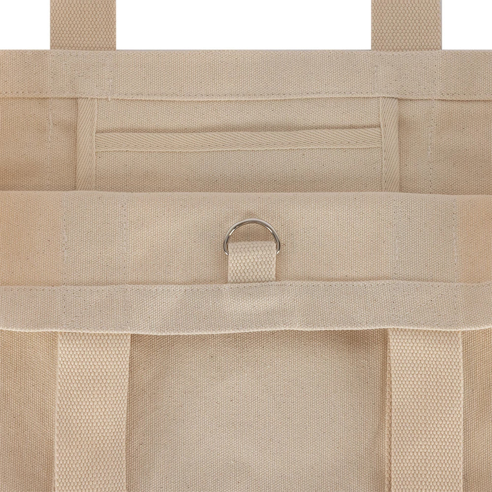 New Era New York Yankees MLB Script Light Beige Tote Bag, back view showing a light beige design with reinforced handles, a D-ring detail attached to a loop on the upper back section, and stitch along the edges.