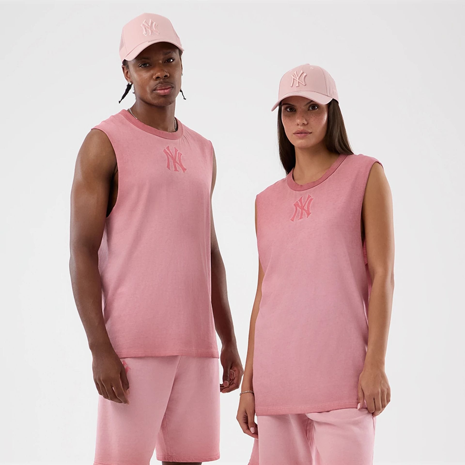 The model is wearing this MLB Washed Logo New York Yankees Vest in pastel pink. 1