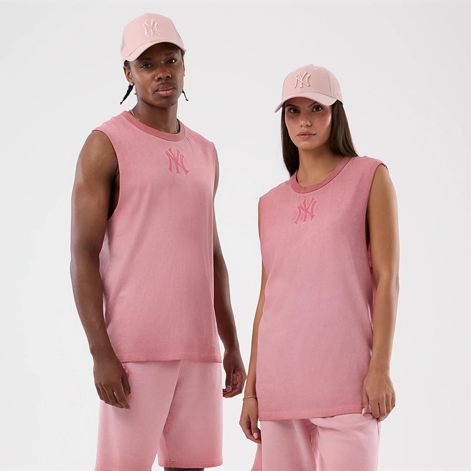 The model is wearing this MLB Washed Logo New York Yankees Vest in pastel pink. 1
