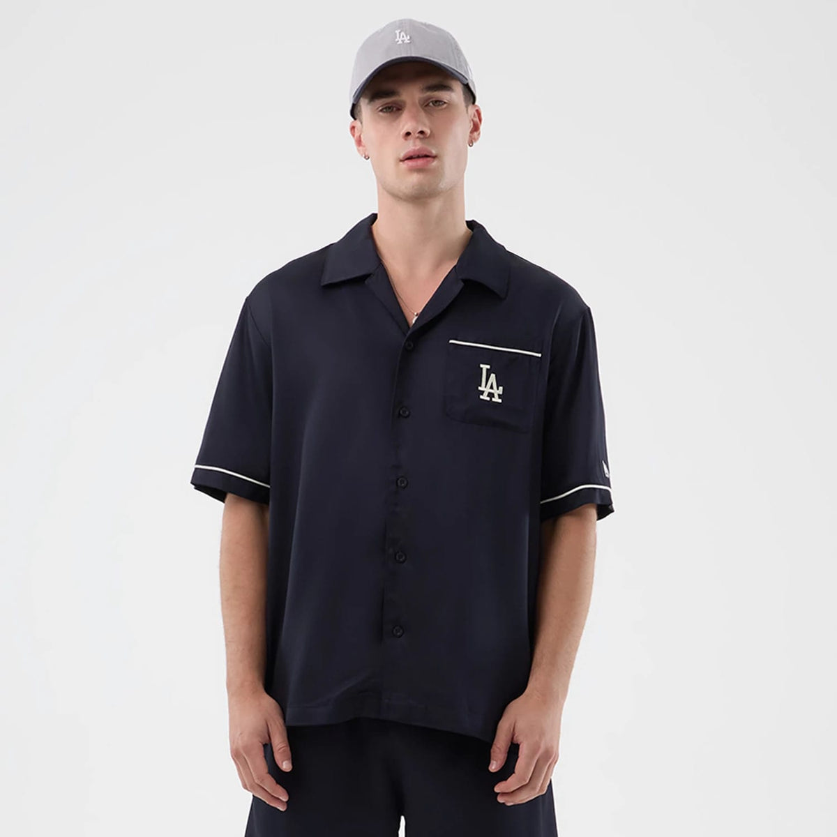 The model is wearing this MLB Graphic Revere LA Dodgers Short Sleeve Shirt in navy. 1
