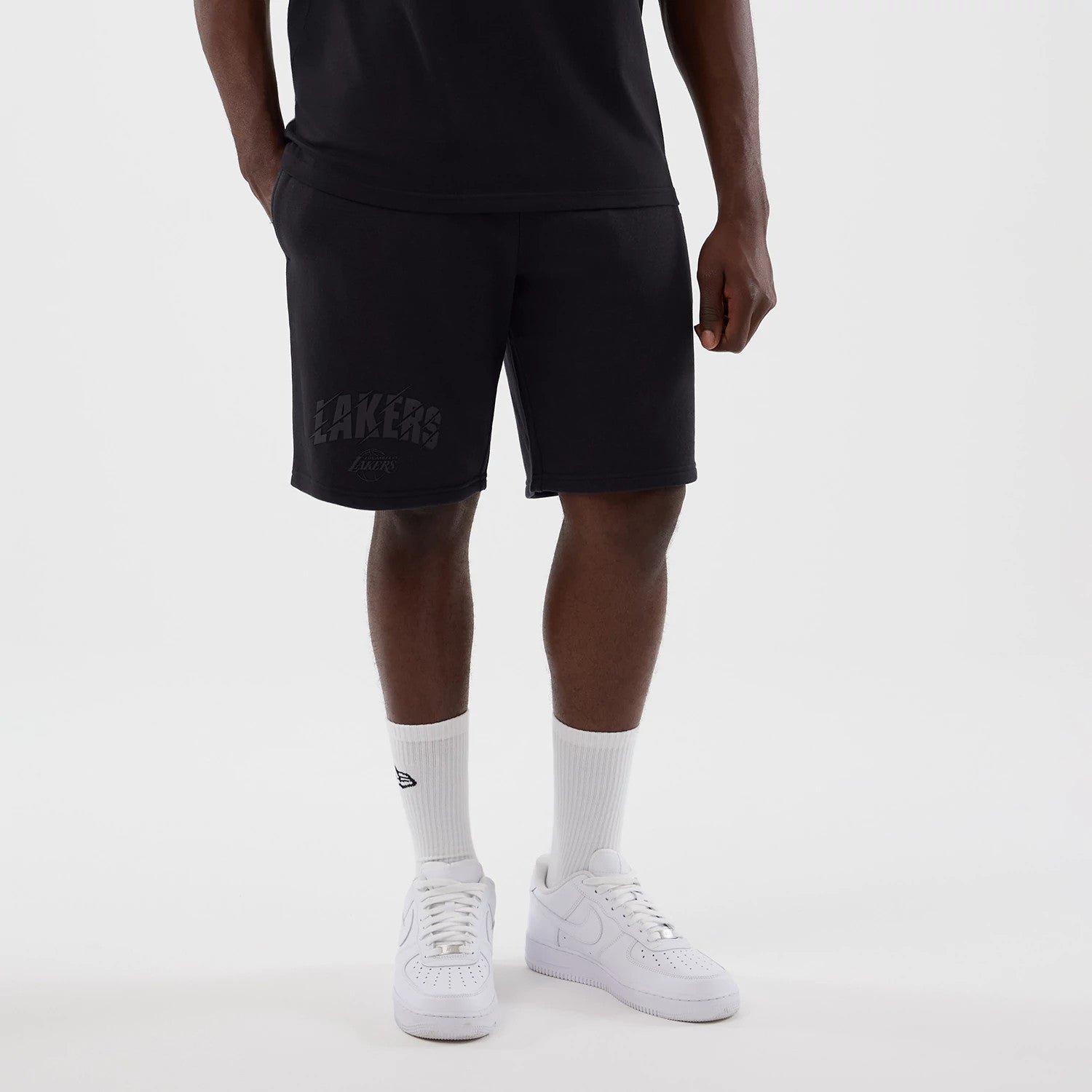 The model is wearing this NBA Core Plus LA Lakers Shorts in navy. 1