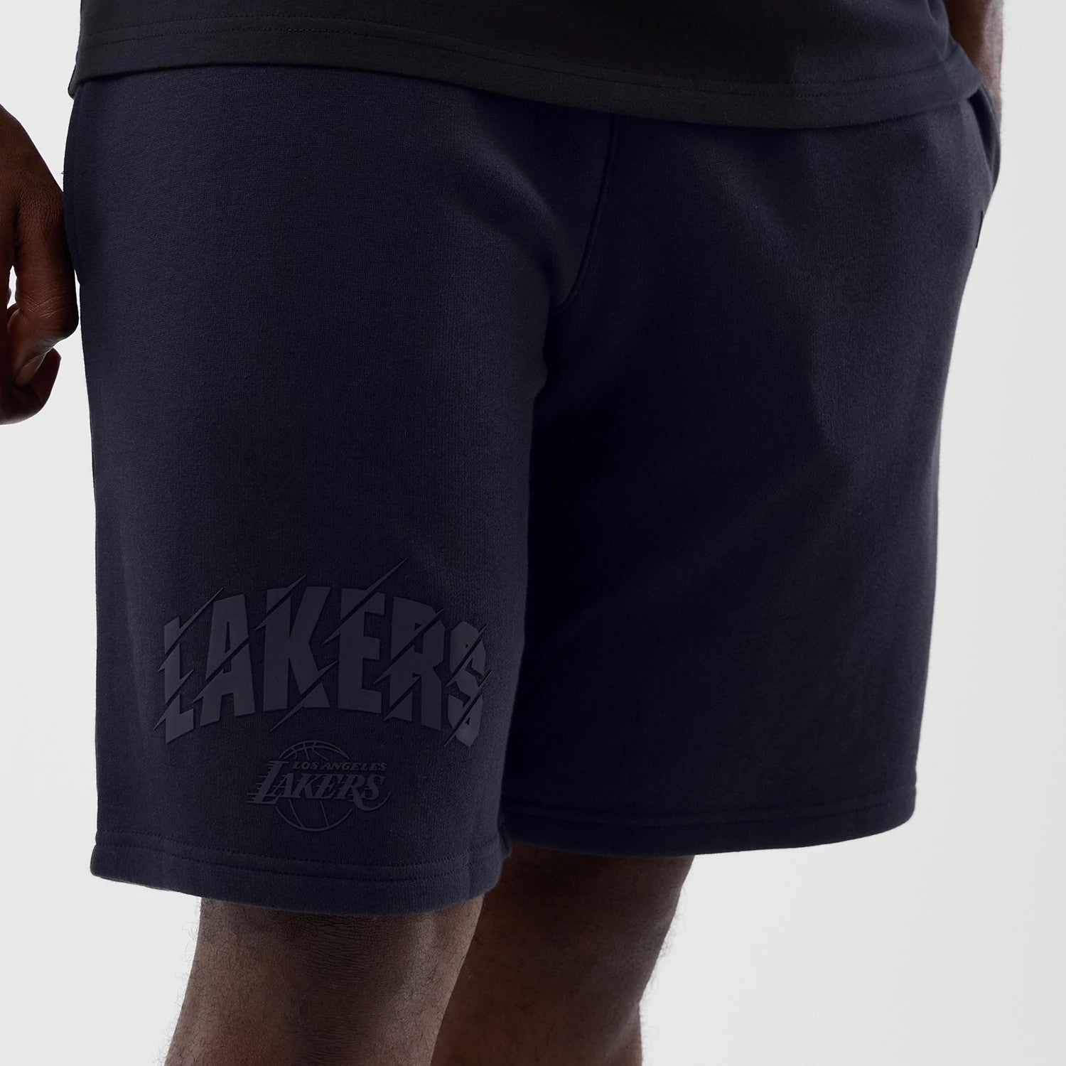 The model is wearing this NBA Core Plus LA Lakers Shorts in navy. 3