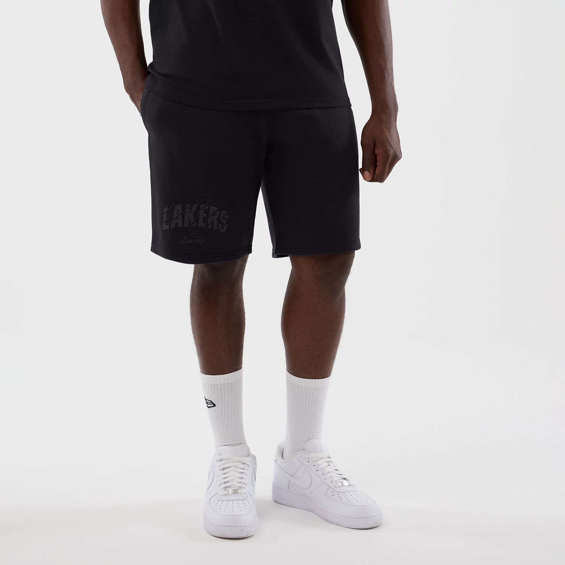 The model is wearing this NBA Core Plus LA Lakers Shorts in navy. 1