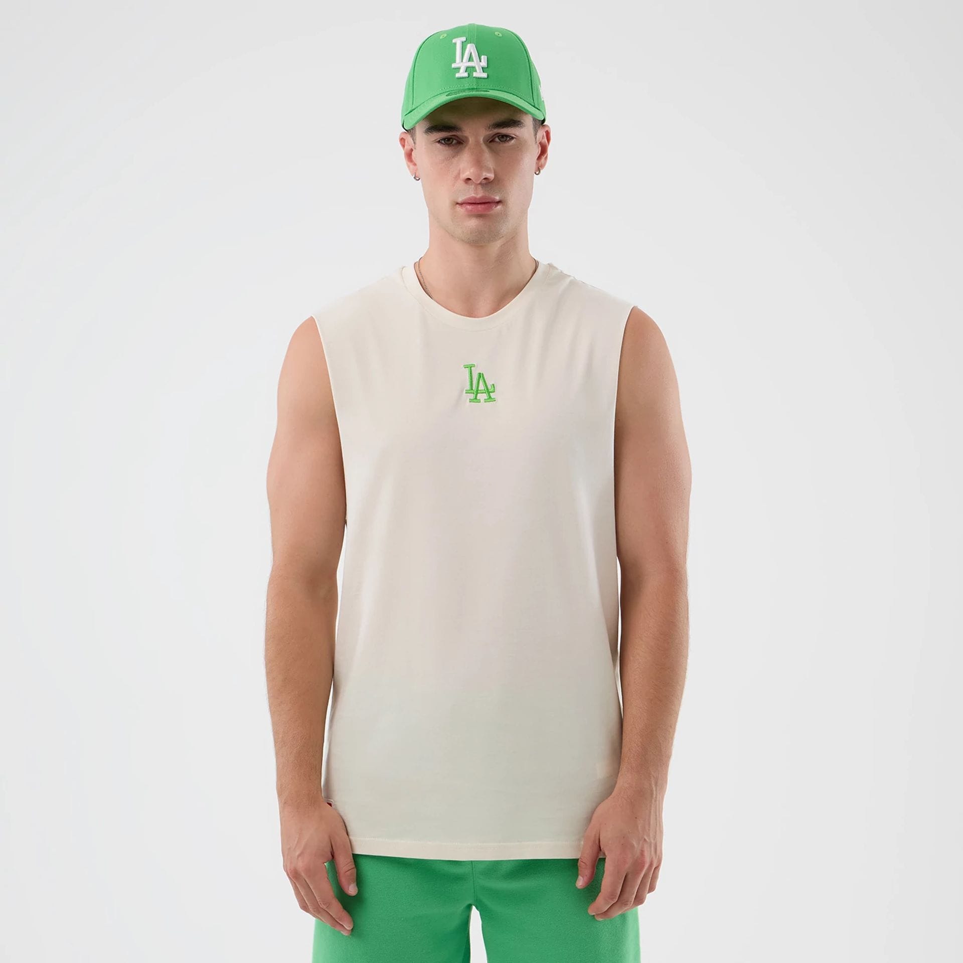 The model is wearing this MLB League Essential LA Dodgers Vest in open white. 1