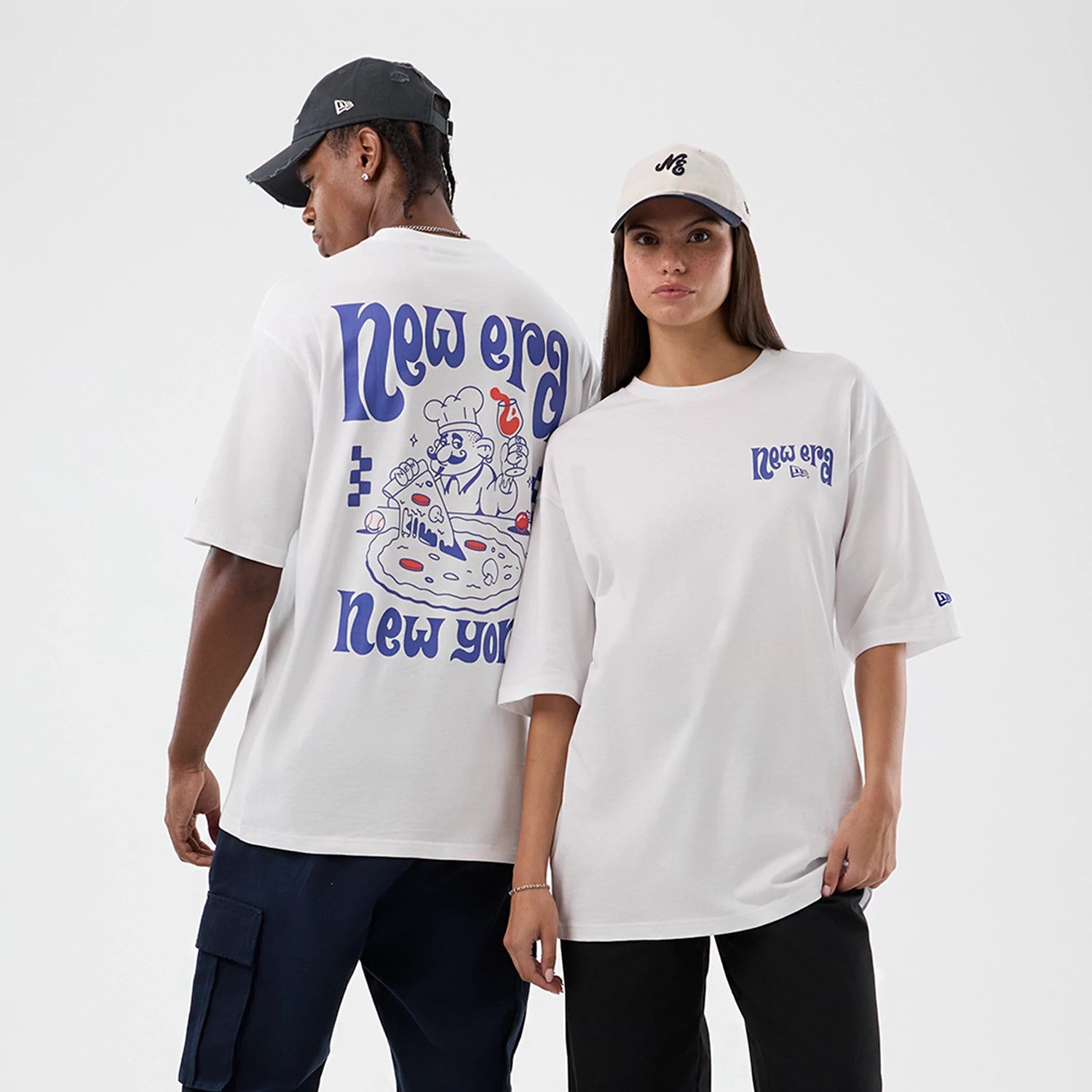 The model is wearing this New Era Fun Pizza Graphic Oversized T-Shirt in white. 1