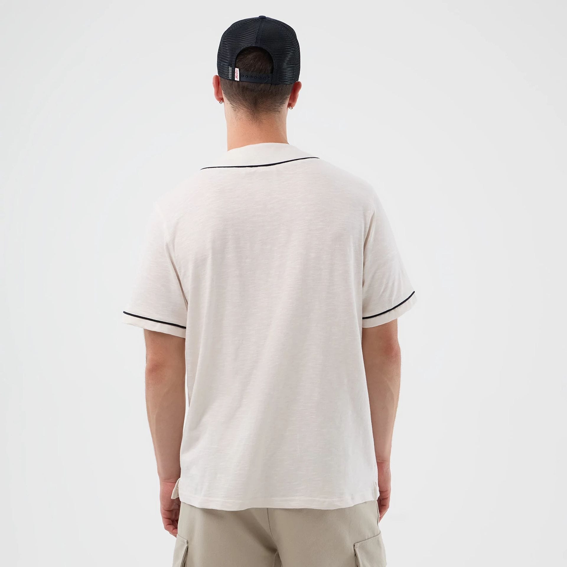 The model is wearing this New Era Slub Baseball Jersey in open white. 2