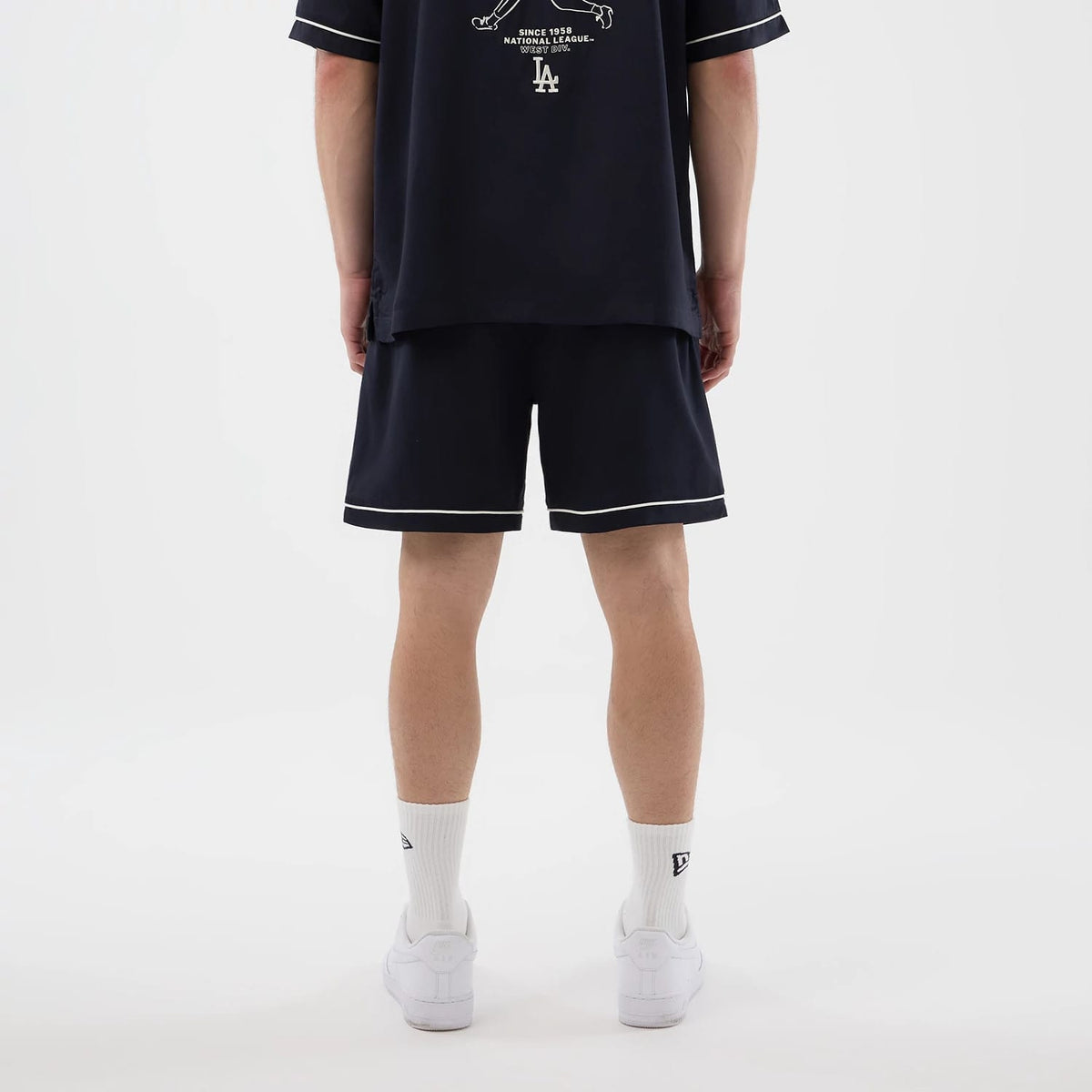 The model is wearing this MLB Woven LA Dodgers Shorts in navy. 2