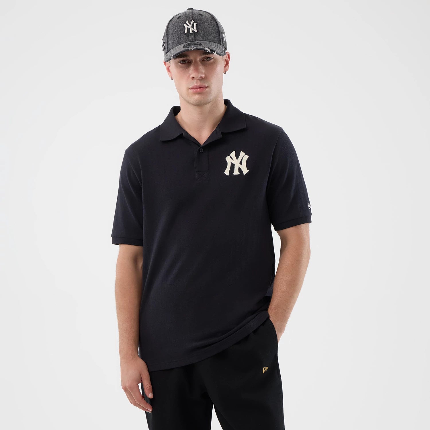 The model is wearing this MLB Rib New York Yankees Polo T-Shirt in navy. 1