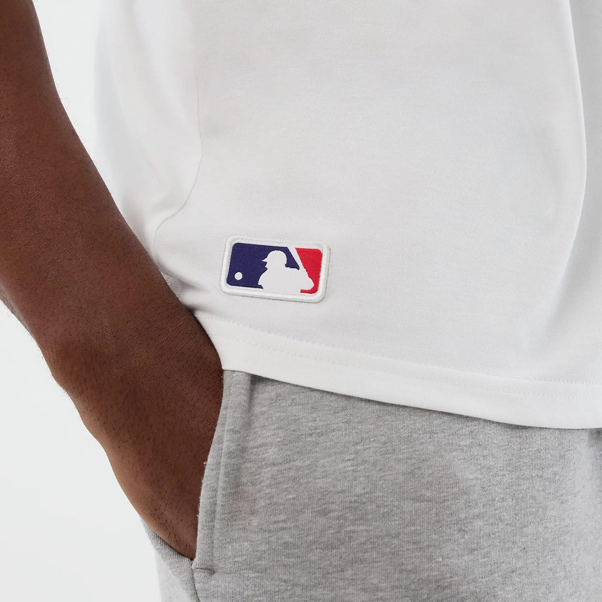 The model is wearing this MLB League Essential Athletics Oversized T-Shirt in white. 8