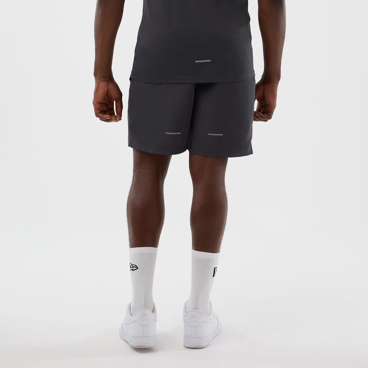 The model is wearing this MLB Core Plus New York Yankees Shorts in dark grey. 2