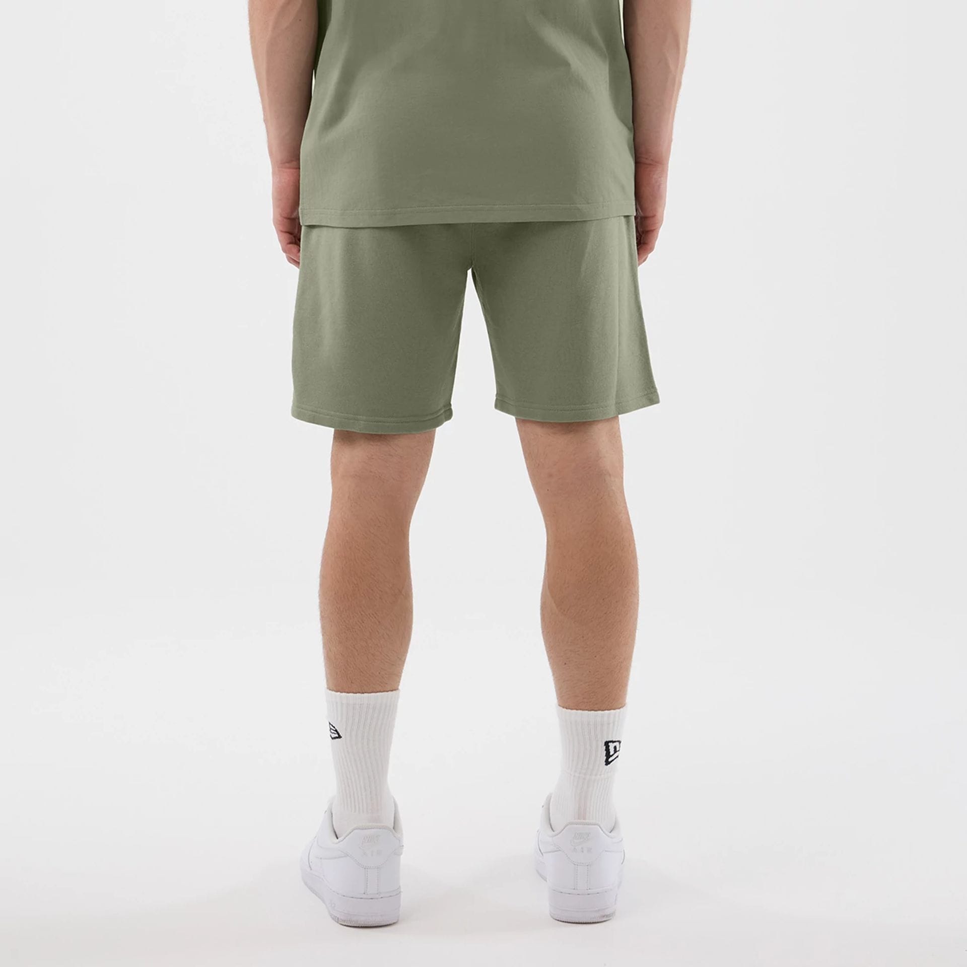 The model is wearing this NBA League Essential Chicago Bulls Shorts in pastel green. 2