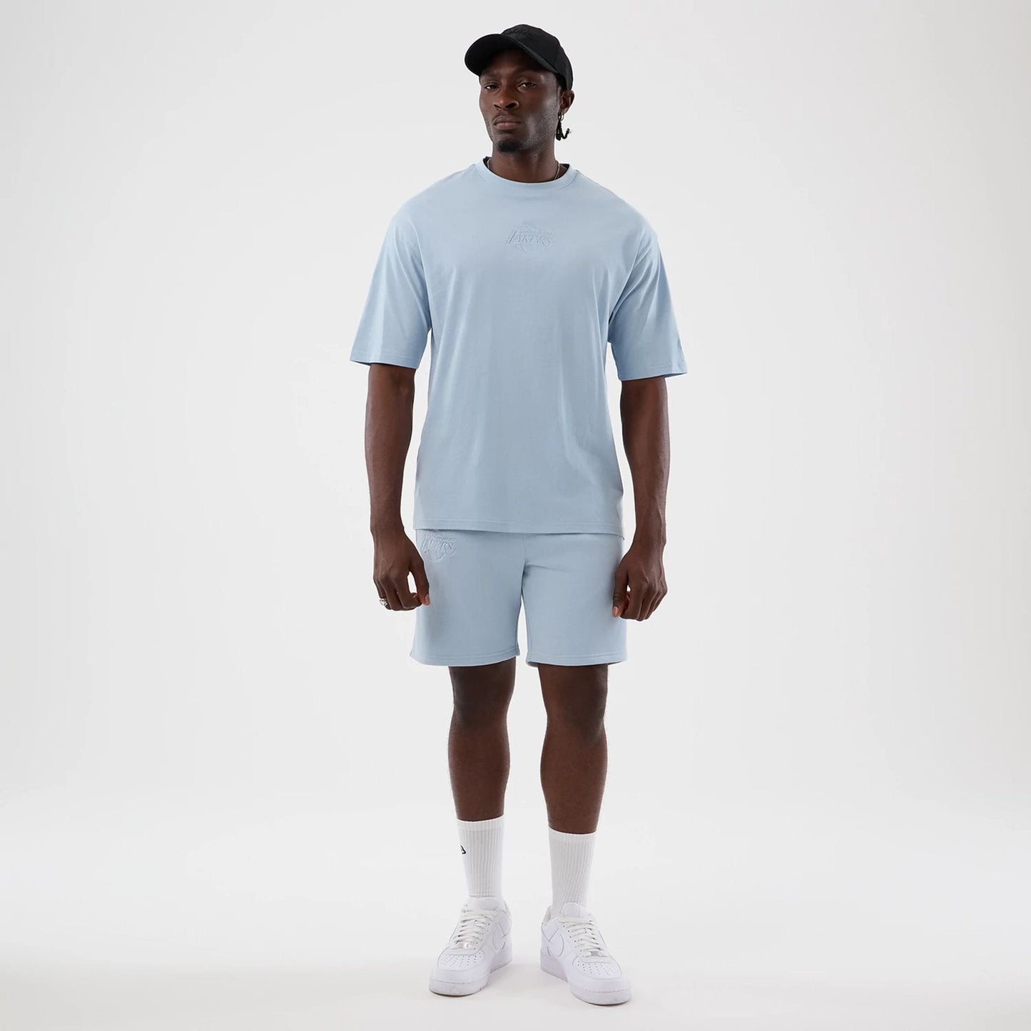 The model is wearing this NBA League Essential LA Lakers Oversized T-Shirt in pastel blue. 8